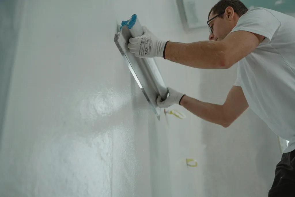 Plasterer at work on construction site