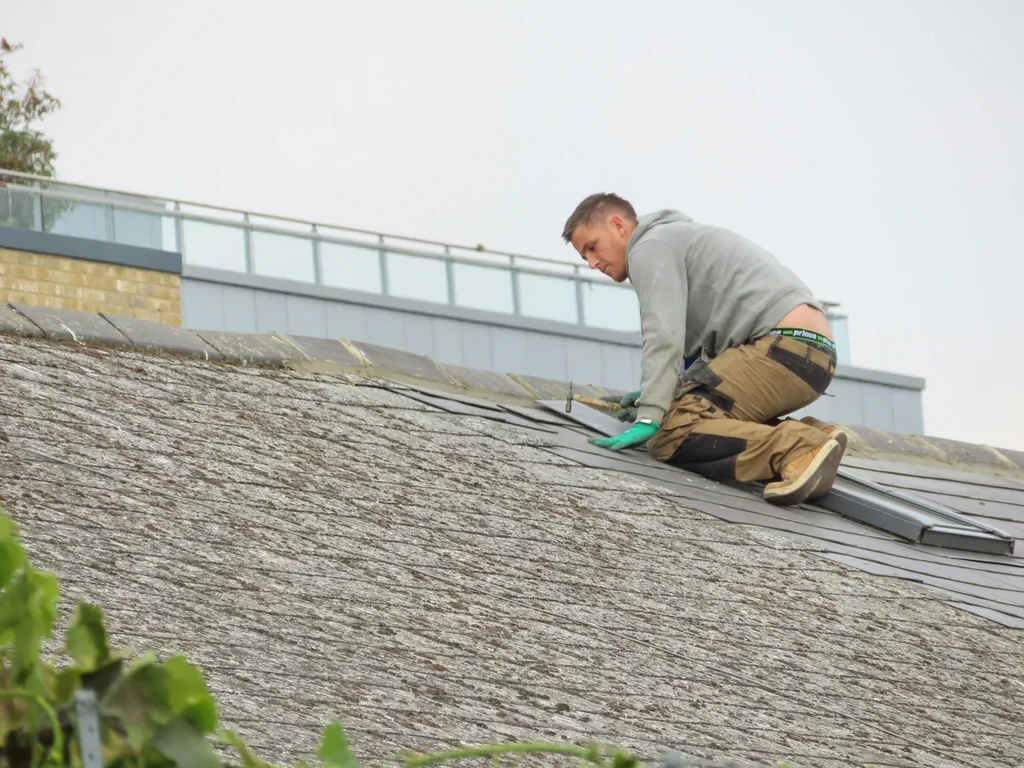 Roofer installing on construction site